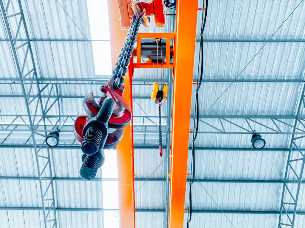 Overhead crane inside factory building, industrial background to illustrate Crane fabrication and installation